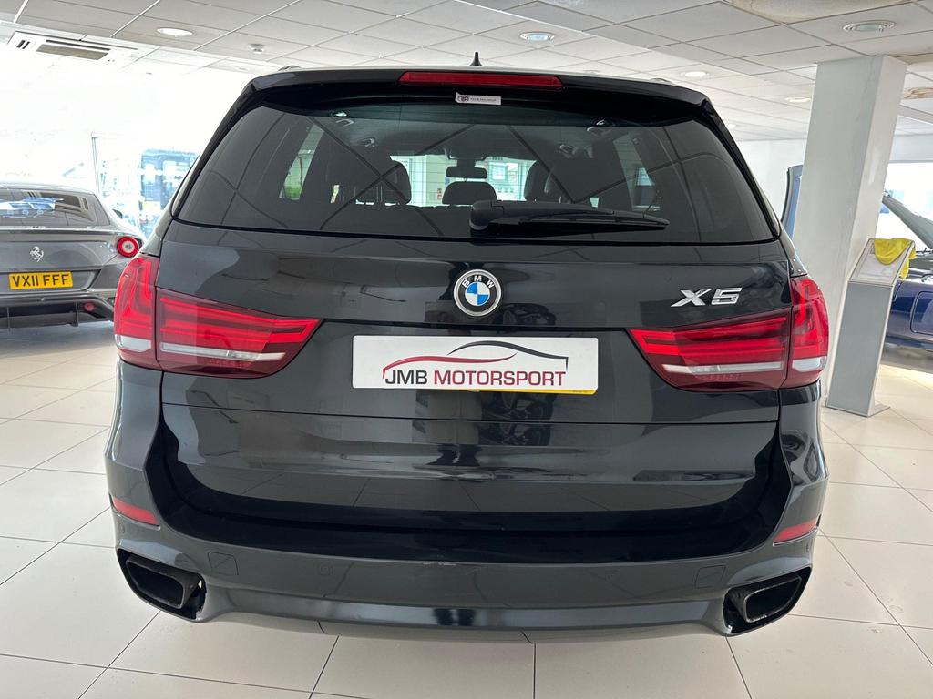BMW X5 3.0 30d M Sport Auto xDrive in black with 20-inch Light Star Spoke alloy wheels, showcasing sleek M Sport bodystyling and High-Gloss Shadowline trim.