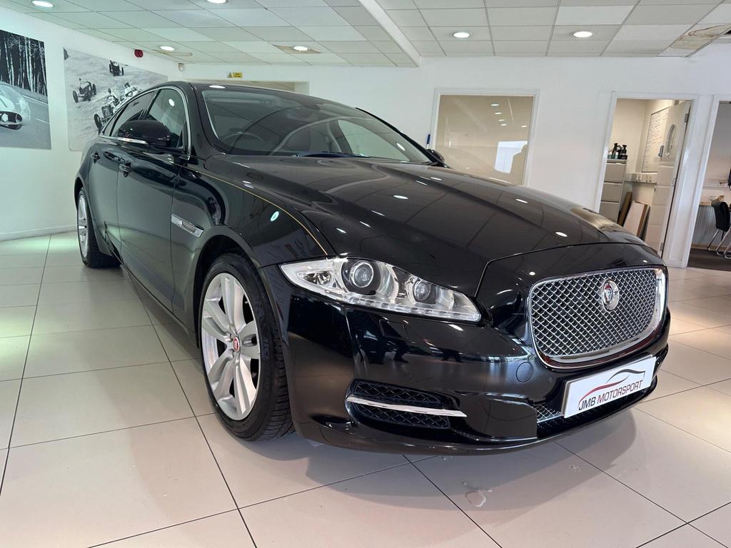 Side view of the Jaguar XJ 3.0D V6 Luxury LWB showcasing sleek design and alloy wheels.