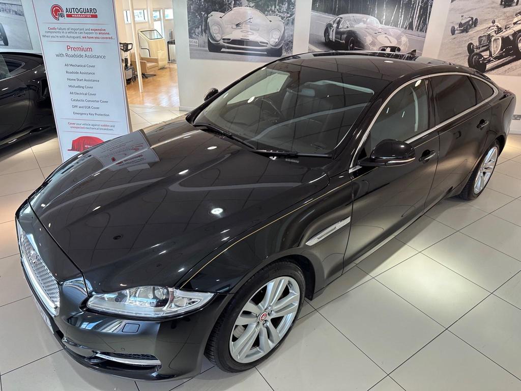 Side view of the Jaguar XJ 3.0D V6 Luxury LWB showcasing sleek design and alloy wheels.