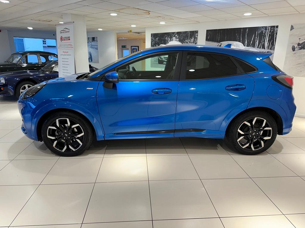 The Ford Puma ST-Line X exterior showcasing its sporty design, alloy wheels, and large rear spoiler.