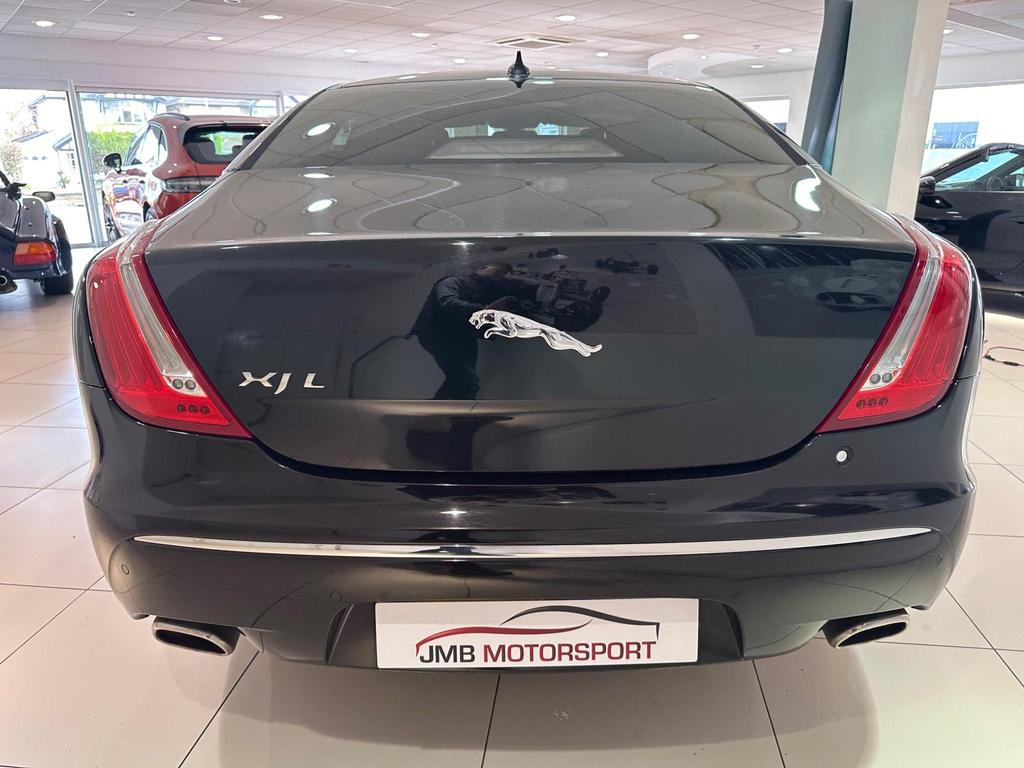Side view of the Jaguar XJ 3.0D V6 Luxury LWB showcasing sleek design and alloy wheels.