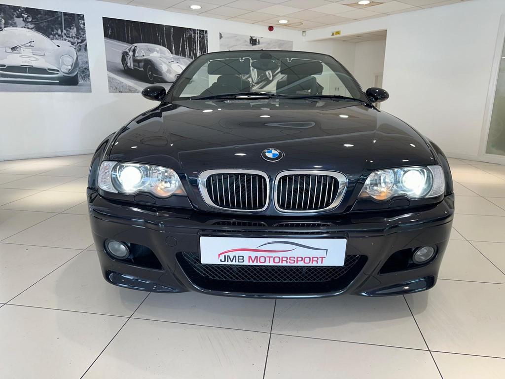 Side view of a black BMW M3 3.2i 2dr with alloy wheels and a hardtop roof.