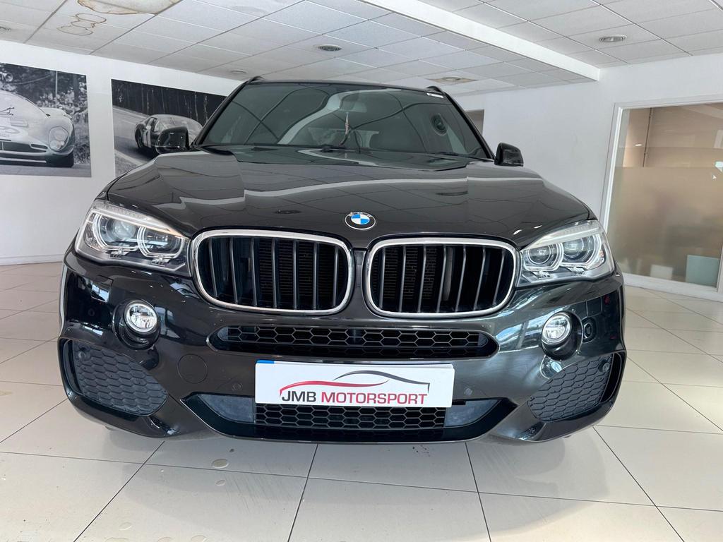 BMW X5 3.0 30d M Sport Auto xDrive in black with 20-inch Light Star Spoke alloy wheels, showcasing sleek M Sport bodystyling and High-Gloss Shadowline trim.