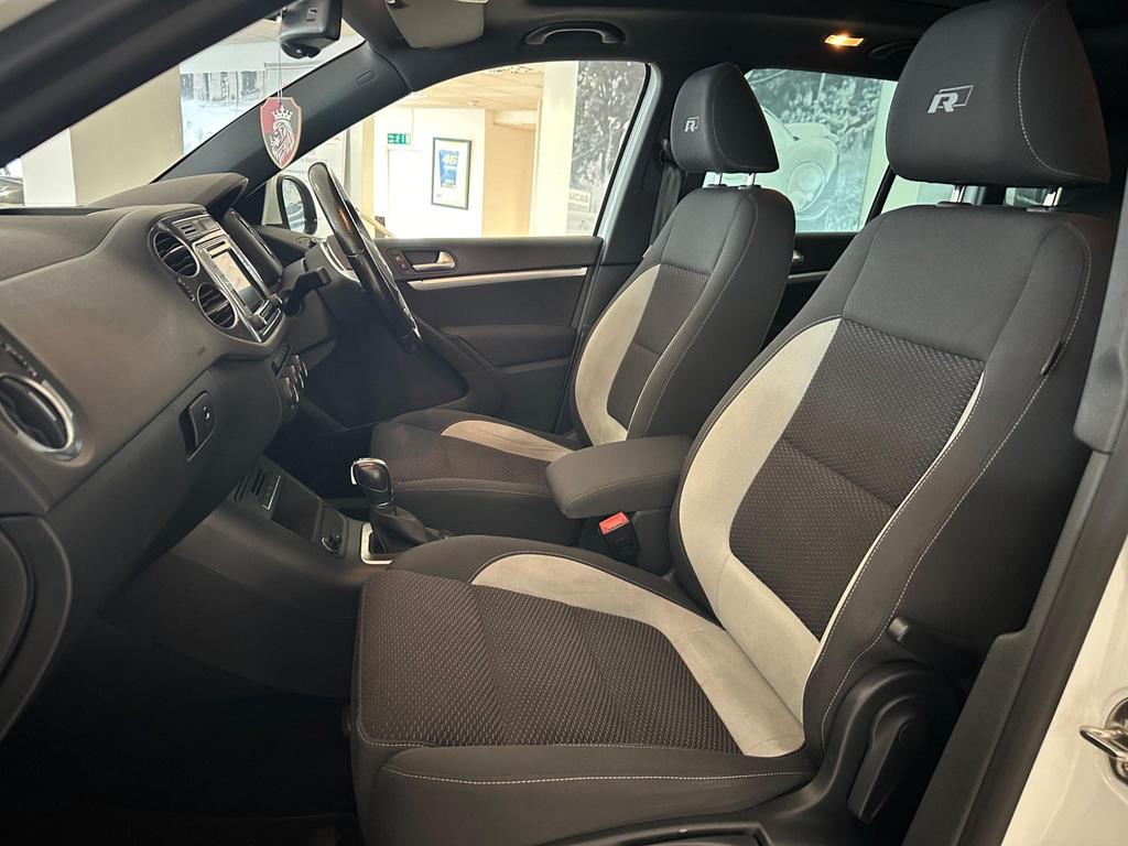 Interior view of Volkswagen Tiguan R-Line, featuring leather gear knob, 6.5-inch touchscreen, and sports seats.