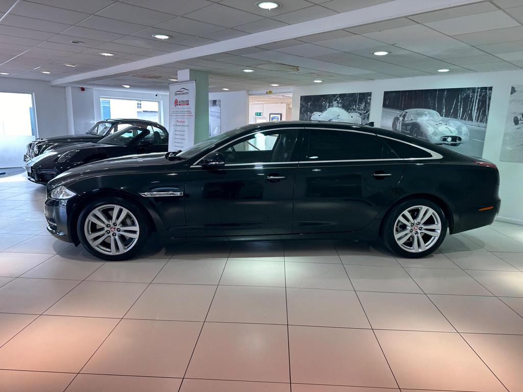 Side view of the Jaguar XJ 3.0D V6 Luxury LWB showcasing sleek design and alloy wheels.