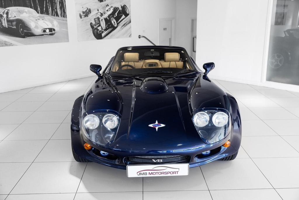 Sleek and aerodynamic Marcos Mantara 3.9 400 Spyder exterior view, restored to perfection.