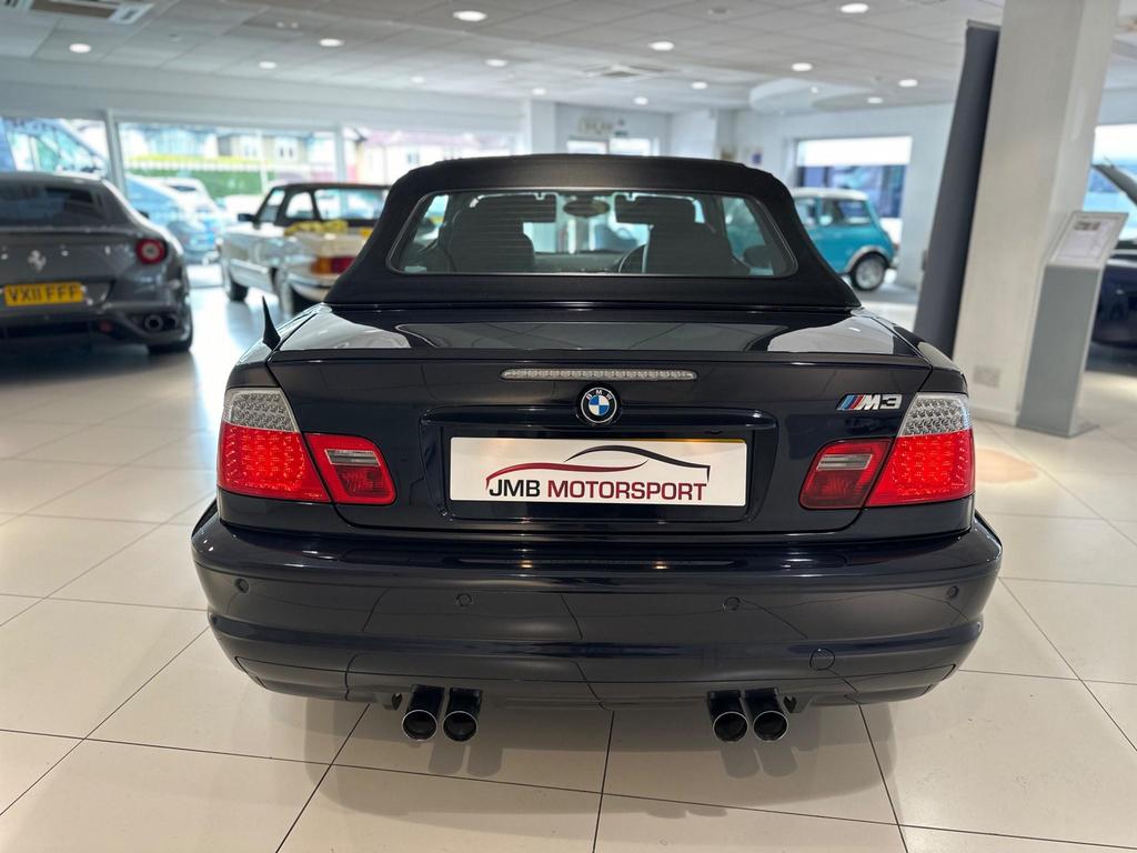 Side view of a black BMW M3 3.2i 2dr with alloy wheels and a hardtop roof.