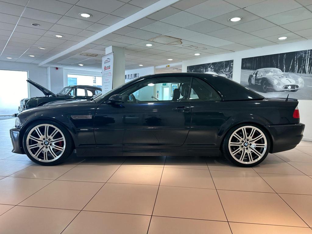 Side view of a black BMW M3 3.2i 2dr with alloy wheels and a hardtop roof.