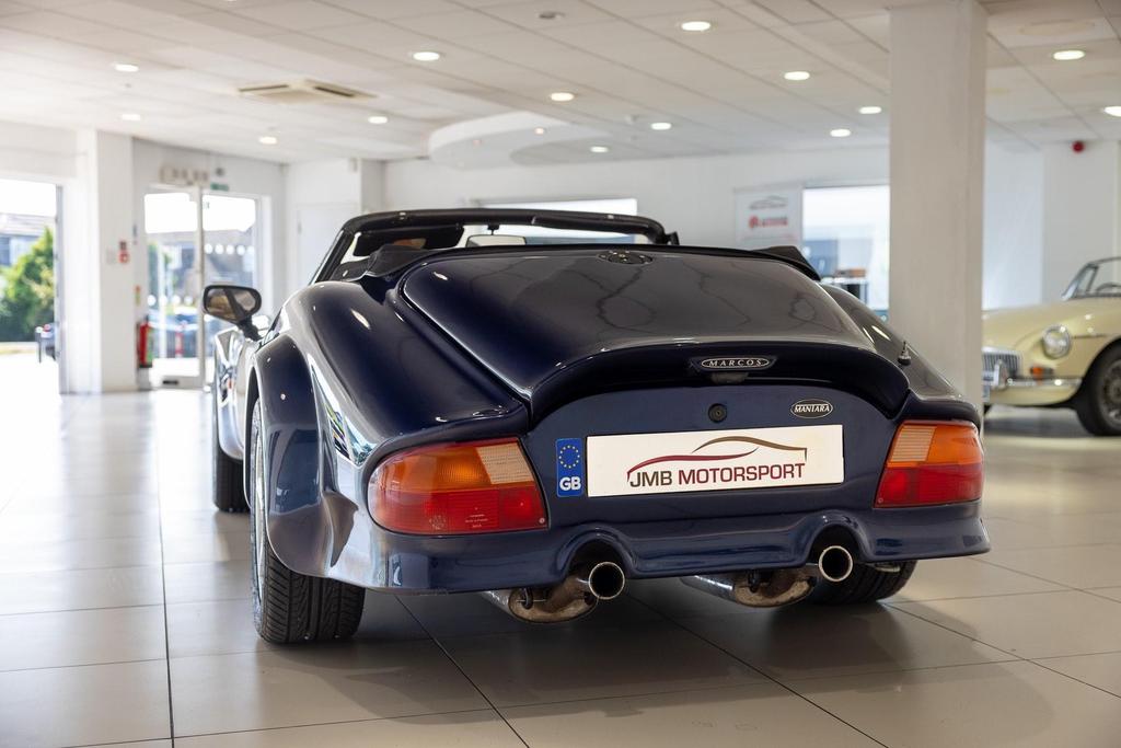 Sleek and aerodynamic Marcos Mantara 3.9 400 Spyder exterior view, restored to perfection.