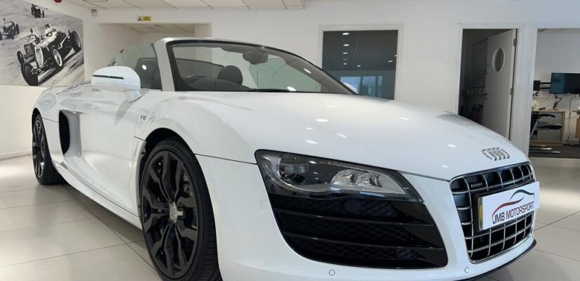 010 Audi R8 5.2 FSI V10 Spyder showcasing its sleek design and iconic grille.