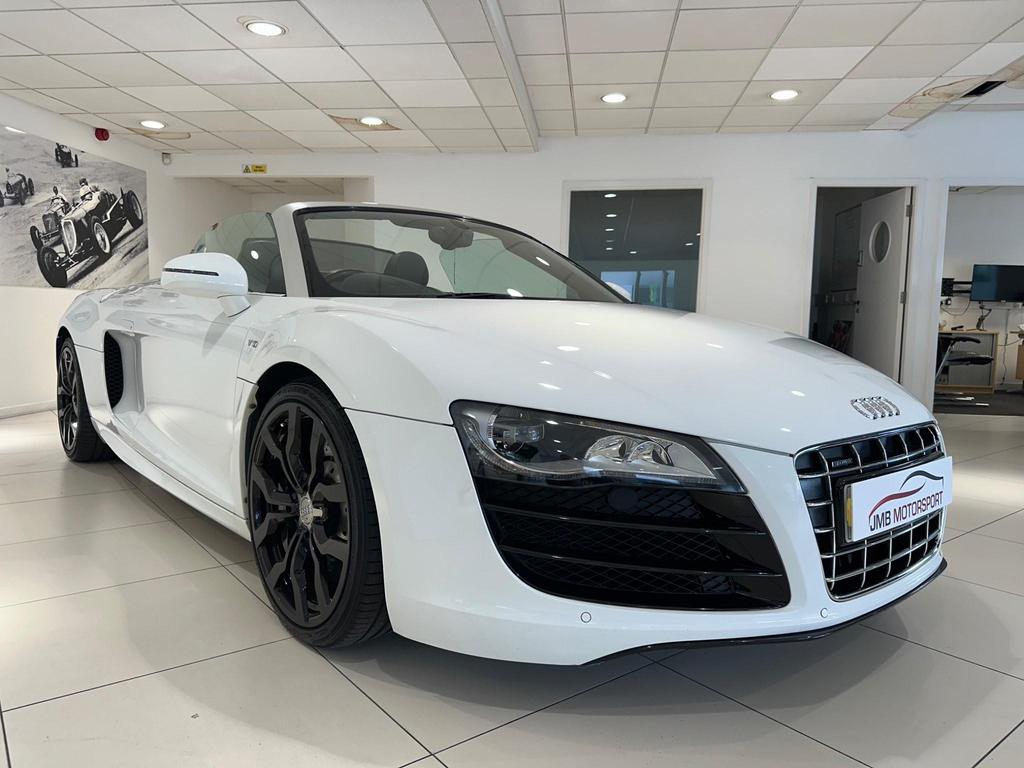 010 Audi R8 5.2 FSI V10 Spyder showcasing its sleek design and iconic grille.
