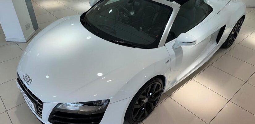 010 Audi R8 5.2 FSI V10 Spyder showcasing its sleek design and iconic grille.