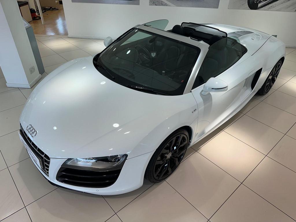 010 Audi R8 5.2 FSI V10 Spyder showcasing its sleek design and iconic grille.