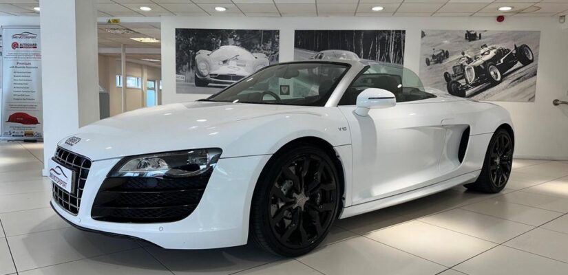 010 Audi R8 5.2 FSI V10 Spyder showcasing its sleek design and iconic grille.