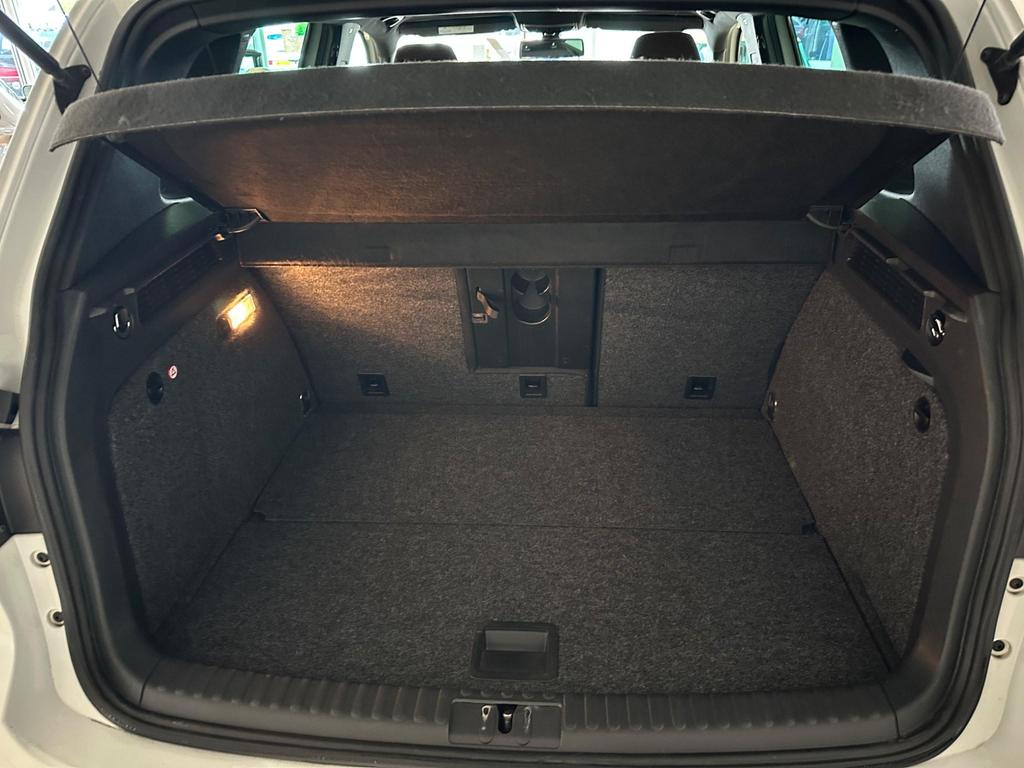 Interior view of Volkswagen Tiguan R-Line, featuring leather gear knob, 6.5-inch touchscreen, and sports seats.