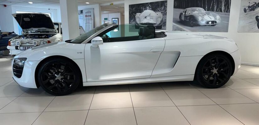 010 Audi R8 5.2 FSI V10 Spyder showcasing its sleek design and iconic grille.