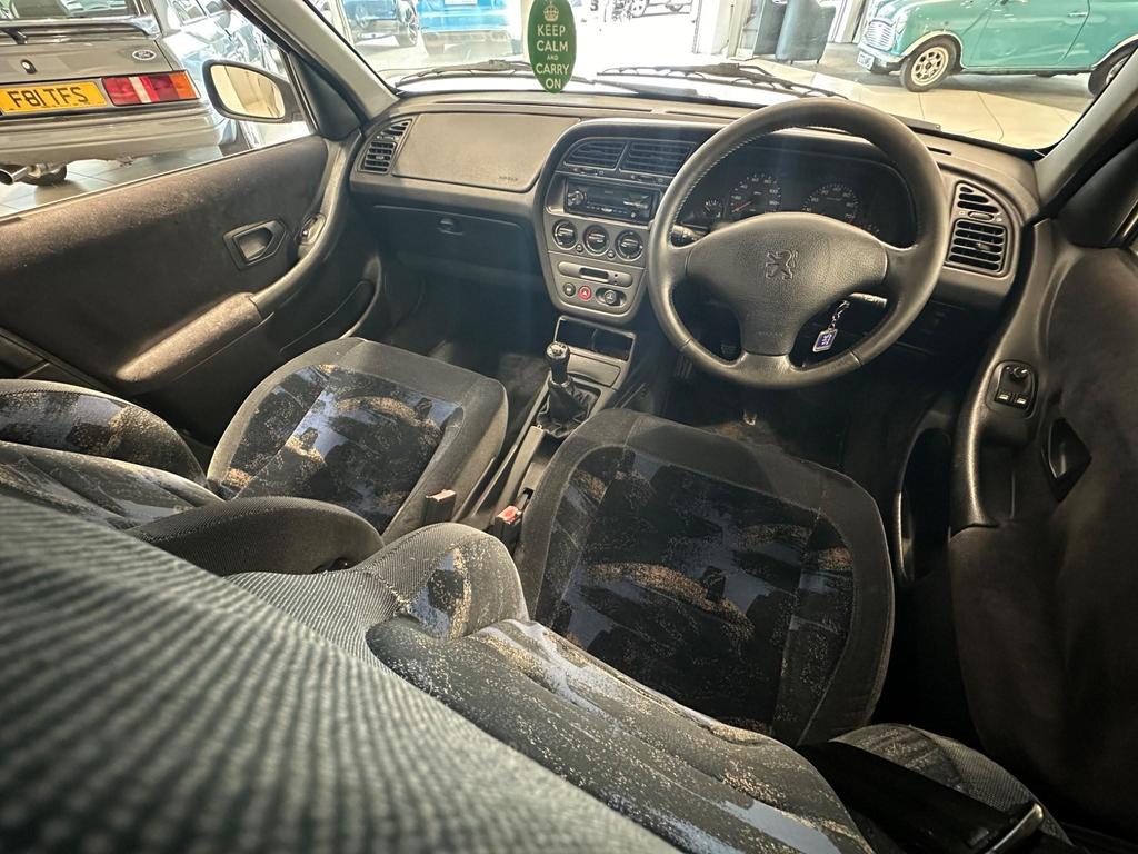 Interior of the 1998 car featuring electric tilt/slide sunroof and front electric windows.