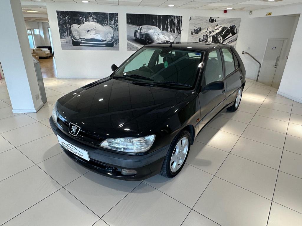 Front view of the 1998 sedan with metallic paint and alloy wheels, showcasing its classic design.