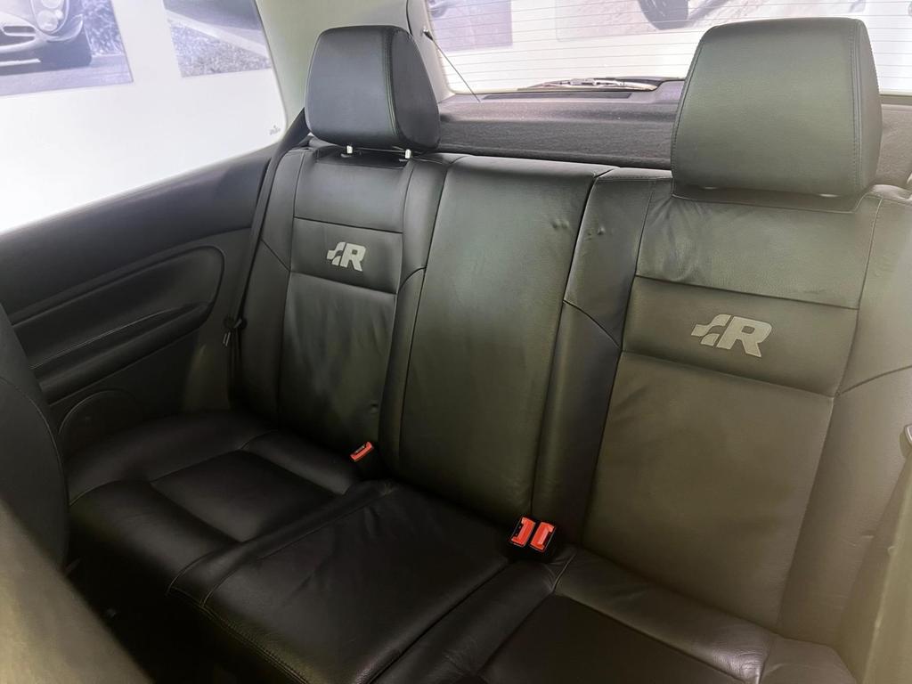 Interior of the VW R32 featuring full leather heated sports seats and a classic dashboard layout.