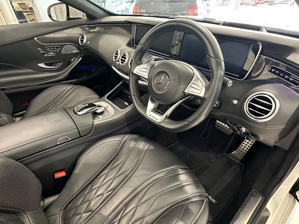 Luxurious interior of the Mercedes S63 AMG with Burmester High-End 3D Surround Sound and Nappa leather seats.