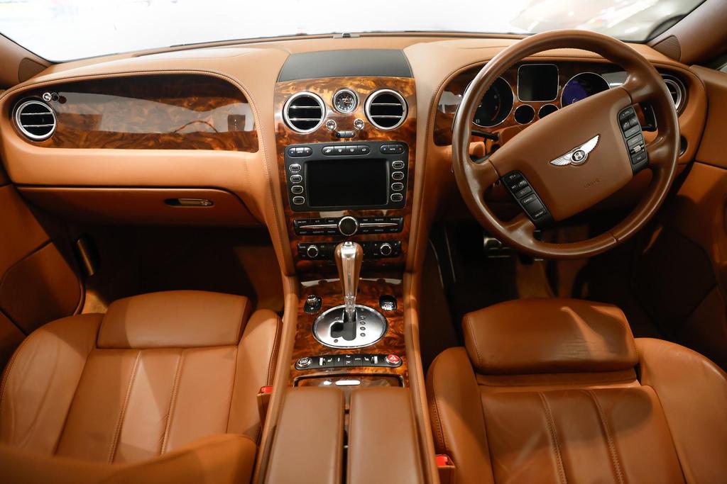 Luxurious interior of the 2005 sedan featuring leather upholstery and climate control for year-round comfort.