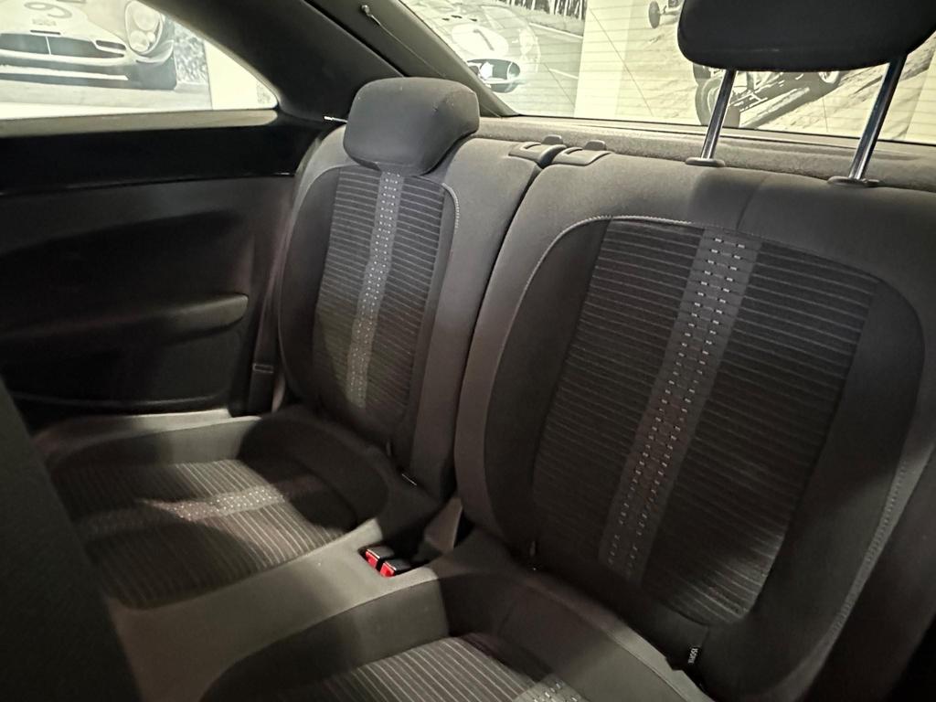 Interior of the VW Beetle featuring comfortable Ferris cloth seats and a classic dashboard layout.
